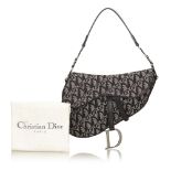 A Dior jacquard 'Diorissimo' saddle handbag, with a black and grey jacquard body, a flat leather