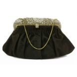 A vintage black suede evening bag,c.1940, with colourless paste stone and seed bead clasp opening to