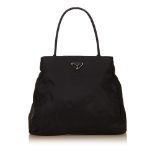 A Prada nylon tote bag, with a black fabric and nylon body, rolled straps, open top, and interior