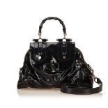 A Gucci 'Bamboo' leather handbag, with a black leather body, flat leather shoulder strap and