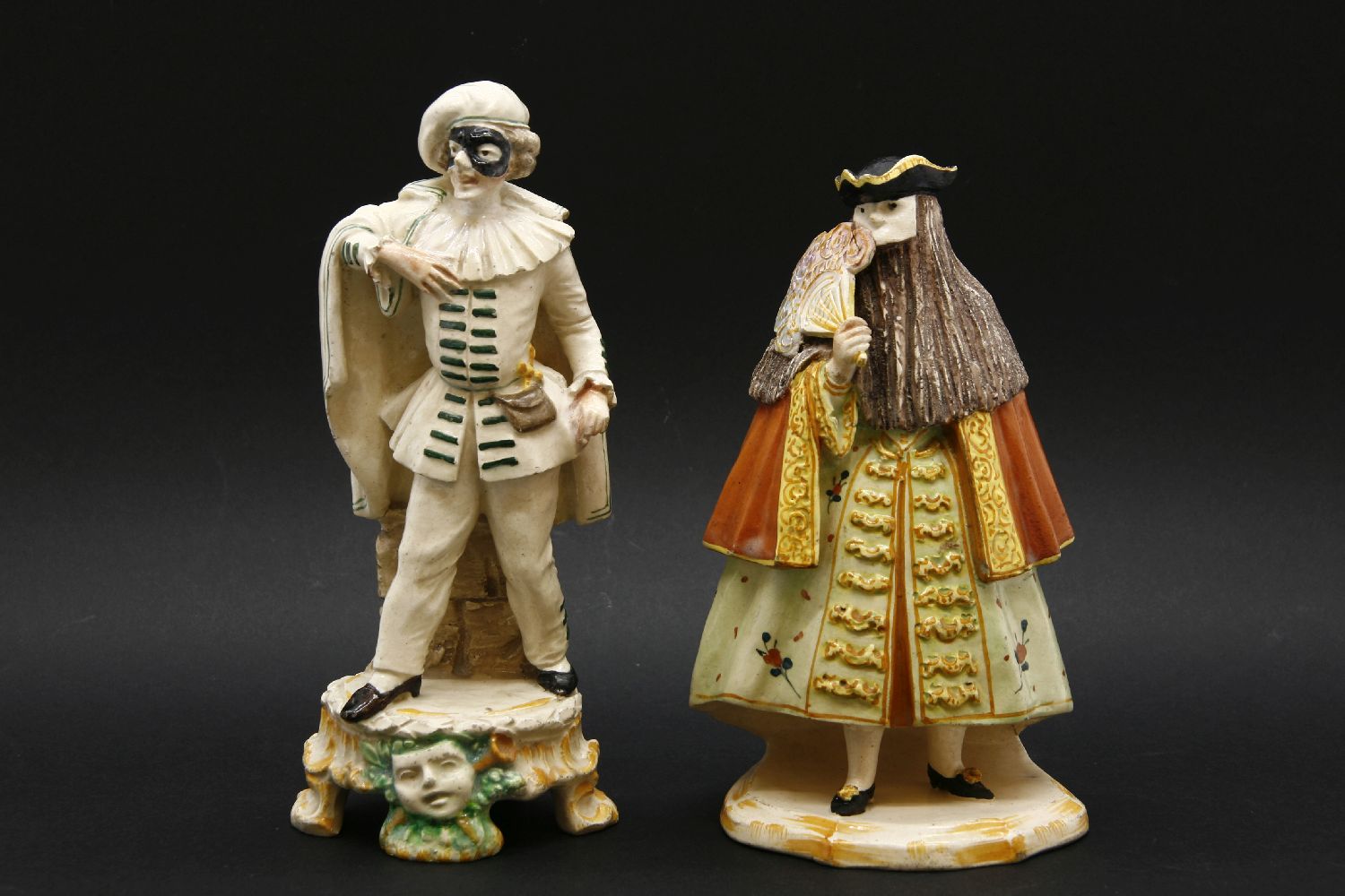 A Cozzi Italian pottery figure of a masked Venetian gentleman, with tricorn hat on shaped base, with