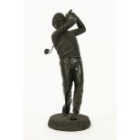 A bronzed model of a golfer, 26cm high