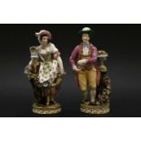 A pair of Minton figures of a gardener and his female companion,the young man dressed in yellow