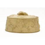 A 19th Century Wedgwood caneware game pie dish, with rabbit finial, moulded with grapevines and