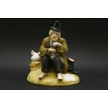 A 20th century Russian porcelain figure of a tramp sat barefoot upon a grassy stump, with Gardner
