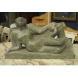 A Modernist sculpture of two embracing reclining figures, of angular form on plinth, 24 cm high,