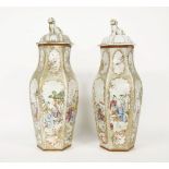 A pair of 19th century Chinese vases and covers, each of hexagonal baluster form, and decorated in