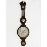 A late 19th century mahogany and crossbanded large banjo barometer, the swan neck pediment over