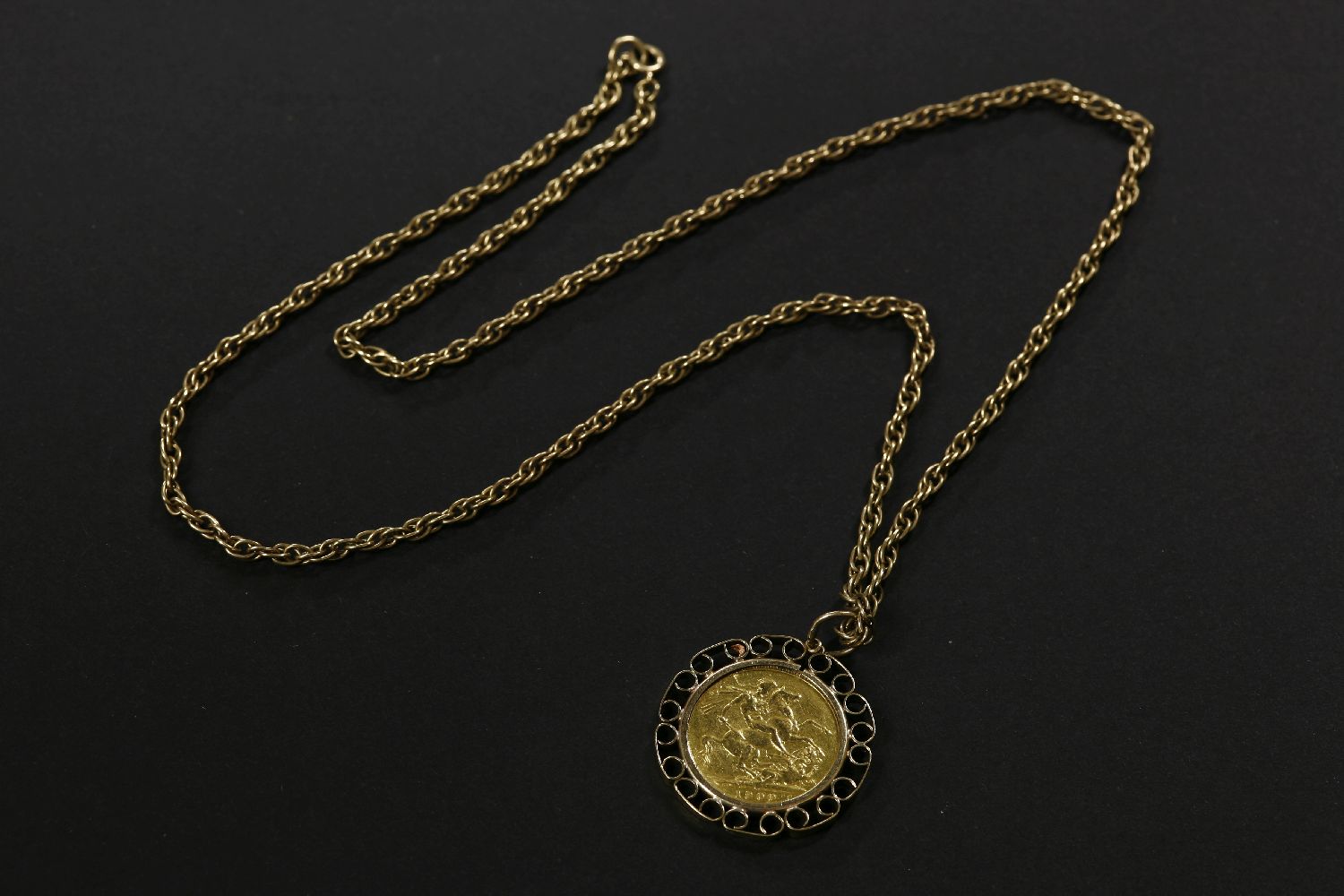 A 1900 gold sovereign, channel set in a 9ct gold mount on a 9ct gold Prince of Wales chain23.30g - Image 2 of 2