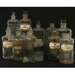 A quantity of apothecary bottles