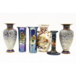 A Moorcroft candlestick, the blue glaze with exotic bird and fruit decoration, 20cm high, together