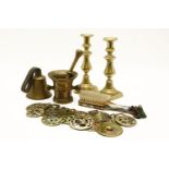 A collection of horse brasses, together with brass preserve pan and pair of brass candlesticks