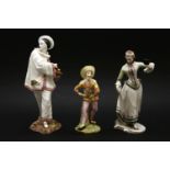 Three Commedia Dell Arte porcelain figures, Pierrot, with gold anchor mark to the base, together