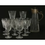 A matched set of eleven cut crystal wine goblets, on knop stems and circular spreading bases,