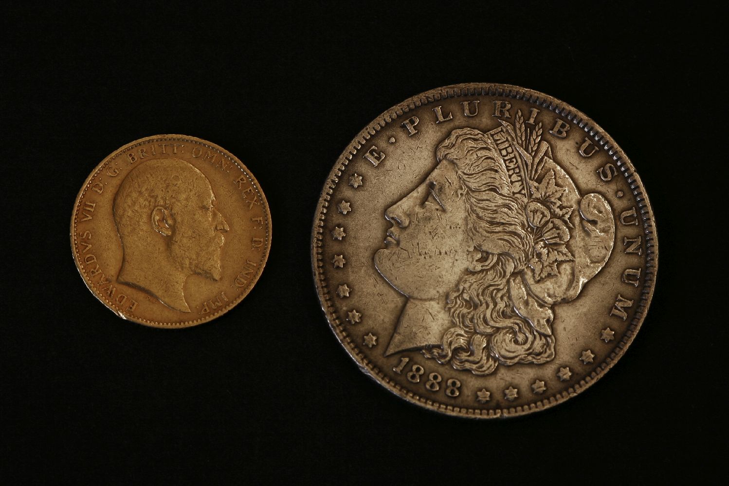 Great Britain and World, an Edward VII Sovereign, 1903, together with an 1888 United States Silver