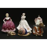 Three Royal Crown Derby paperweights, in the forms of a dragon, a cat and snail, together with three