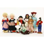 A collection of Continental tourist dolls