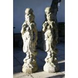 A pair of composition stone figures, 102cm high