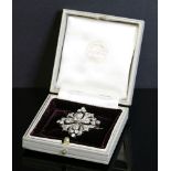A Victorian diamond set quatrefoil brooch/pendant, c.1880,with an old European cut diamond,