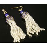 A pair of gold enamel and seed pearl tassel drop earrings,with pierced caps decorated with blue