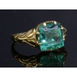 A Victorian gold single stone emerald ring,with a cushion-shaped, mixed Peruzzi cut emerald, each