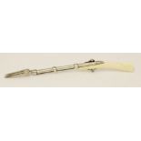 An 18th century silver and ivory fork in the form of rifle,apparently unmarked,in the form of a