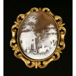 A Victorian gold and sea scroll cameo brooch/pendant mount,with a later replacement shell cameo, the