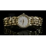 A ladies' 18ct gold diamond set Concord quartz bracelet watch,with a cream dial with gold dot batons