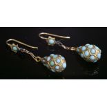 A pair of cabochon turquoise drop earrings,with pear-shaped gold pippin drops, grain set with