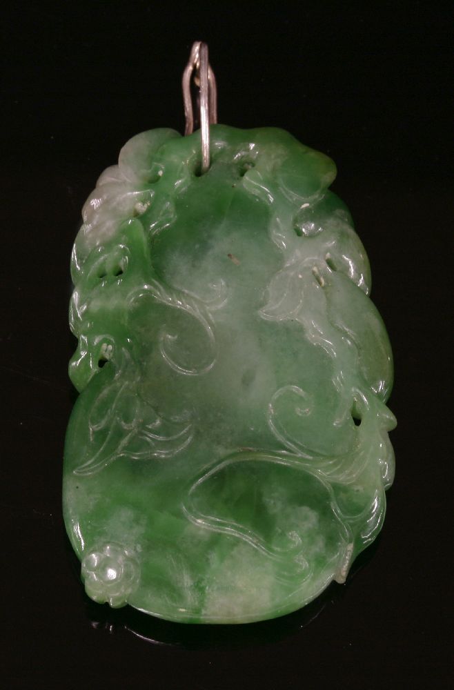 A Chinese carved jade pendant,depicting a gourd with a bird and foliage to a later, hinged wire