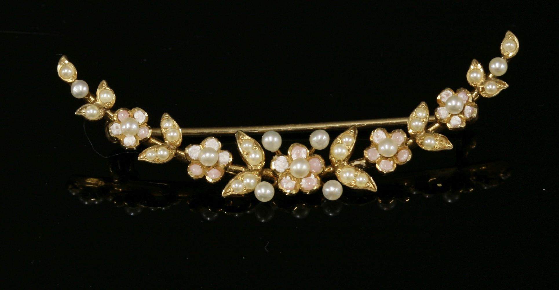 A cased American gold, coral and seed pearl, open crescent spray brooch, c.1910,graduated leaf