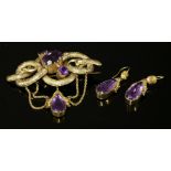 A Victorian gold amethyst brooch and earring suite, c.1870,with a knot-style brooch with three