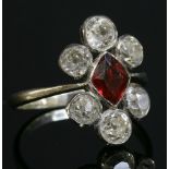 A red paste and diamond fingerline cluster ring, c.1920,with a lozenge-shaped, mixed cut, red paste,