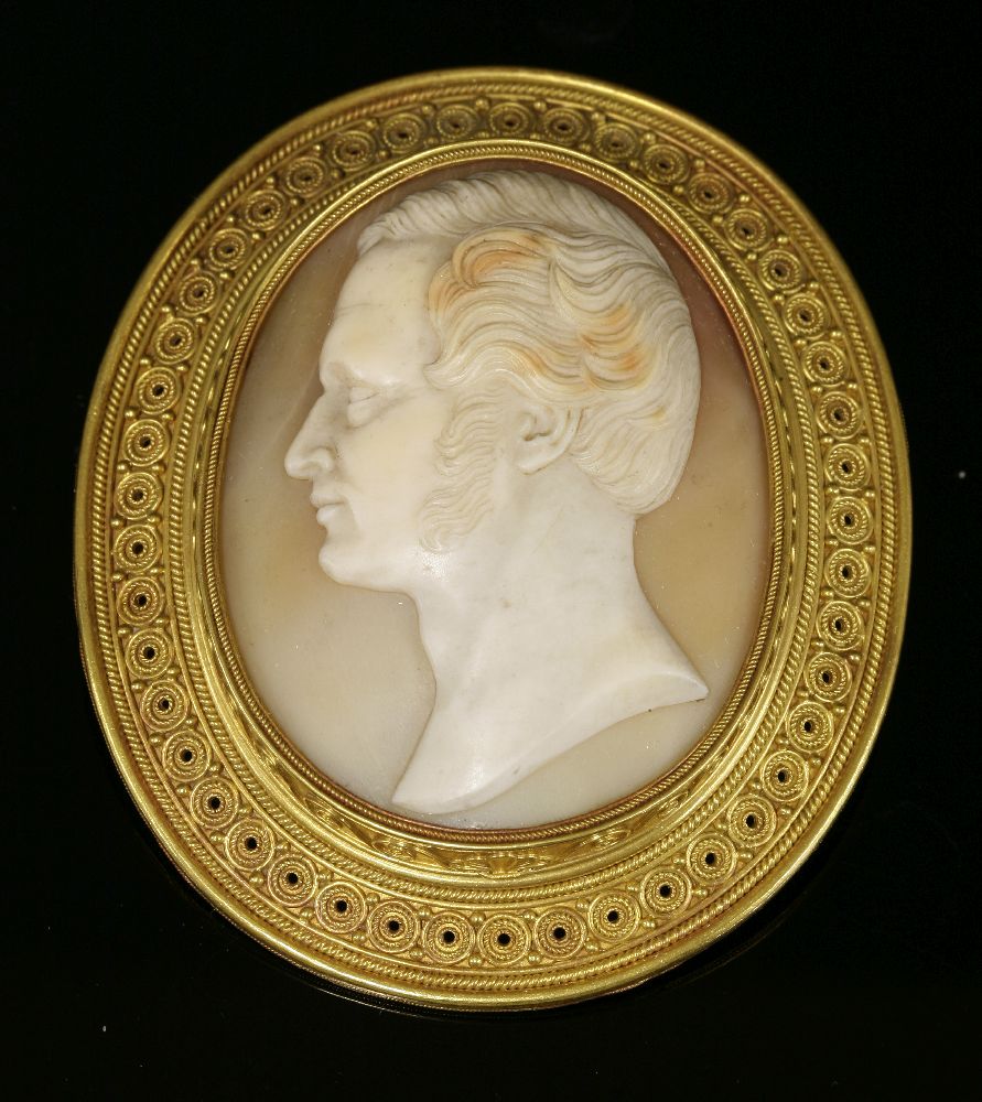 An Archaeological Revival gold shell cameo brooch, c.1865,by Castellani. The oval carved shell cameo