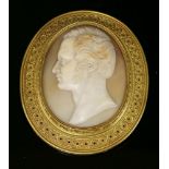 An Archaeological Revival gold shell cameo brooch, c.1865,by Castellani. The oval carved shell cameo