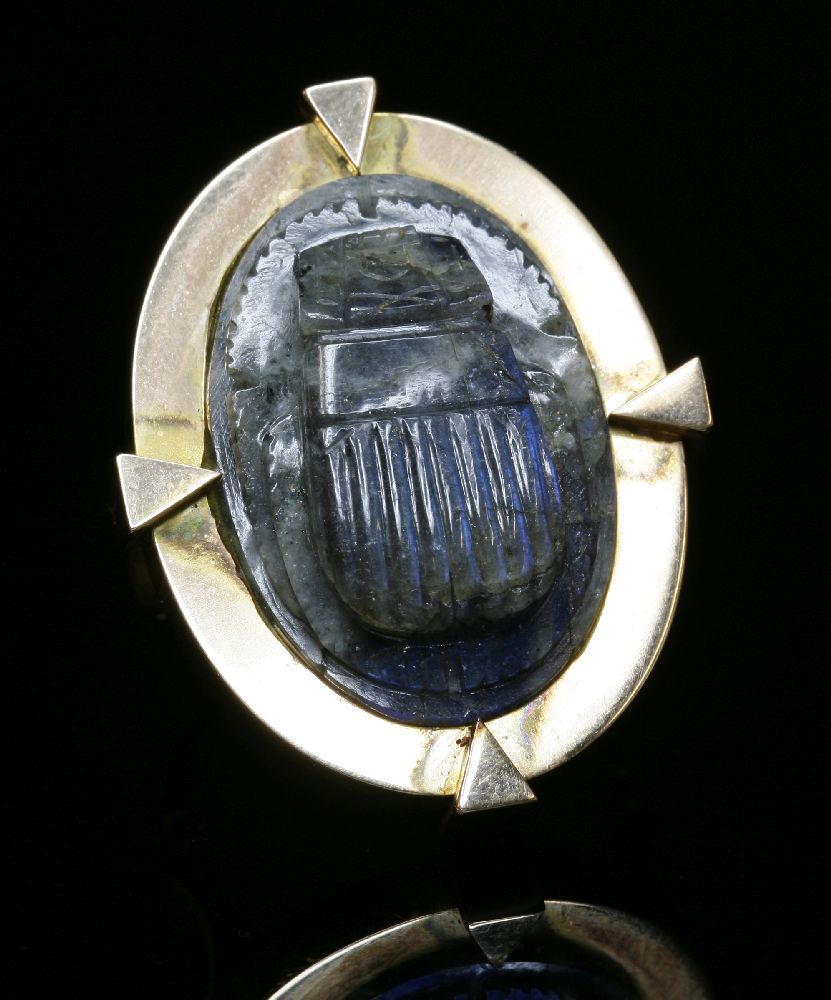 A gold labradorite carved scarab beetle ring,with the carved scarab rub set to a flat section