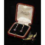 A pair of cased pink sapphire and seed pearl drop earrings, c.1915,each earring with a cushion cut