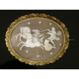 A Victorian gold-mounted shell cameo brooch depicting Aurora in a chariot riding across the night