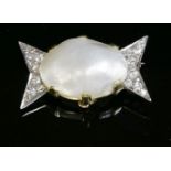 A gold, blister pearl and diamond bow-tie-style brooch,with an oval blister pearl, claw set to the