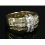 A two-colour gold, diamond set ring,with two central rows of baguette cut diamonds, channel set in a