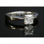 An 18ct white gold single stone diamond ring,with a cushion-shaped modified brilliant cut diamond,