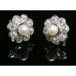 A pair of cultured pearl and diamond daisy cluster earrings,with a cultured pearl, peg set to the