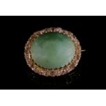 A Victorian turquoise and diamond oval cluster brooch,with an oval cabochon turquoise, claw set to