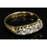 An 18ct gold late Victorian five stone diamond ring,with five graduated old European cut and old