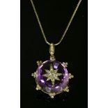 A Victorian amethyst and diamond set star pendant,with an oval Brazilian cut amethyst, claw set to a