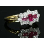 An 18ct yellow and white gold, ruby and diamond landscape cluster ring,three rectangular emerald cut