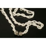 A seed pearl and gem set torsade necklace,with six rows of twisted seed pearls, strung plain to