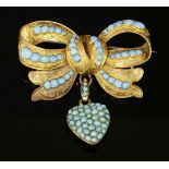 A Victorian gold and turquoise bow brooch, c.1850,with a later heart-shaped pendant drop. The bow