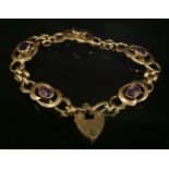 An Edwardian Art Noveau-style amethyst bracelet,with a series of scrolling whiplash-style plaques,