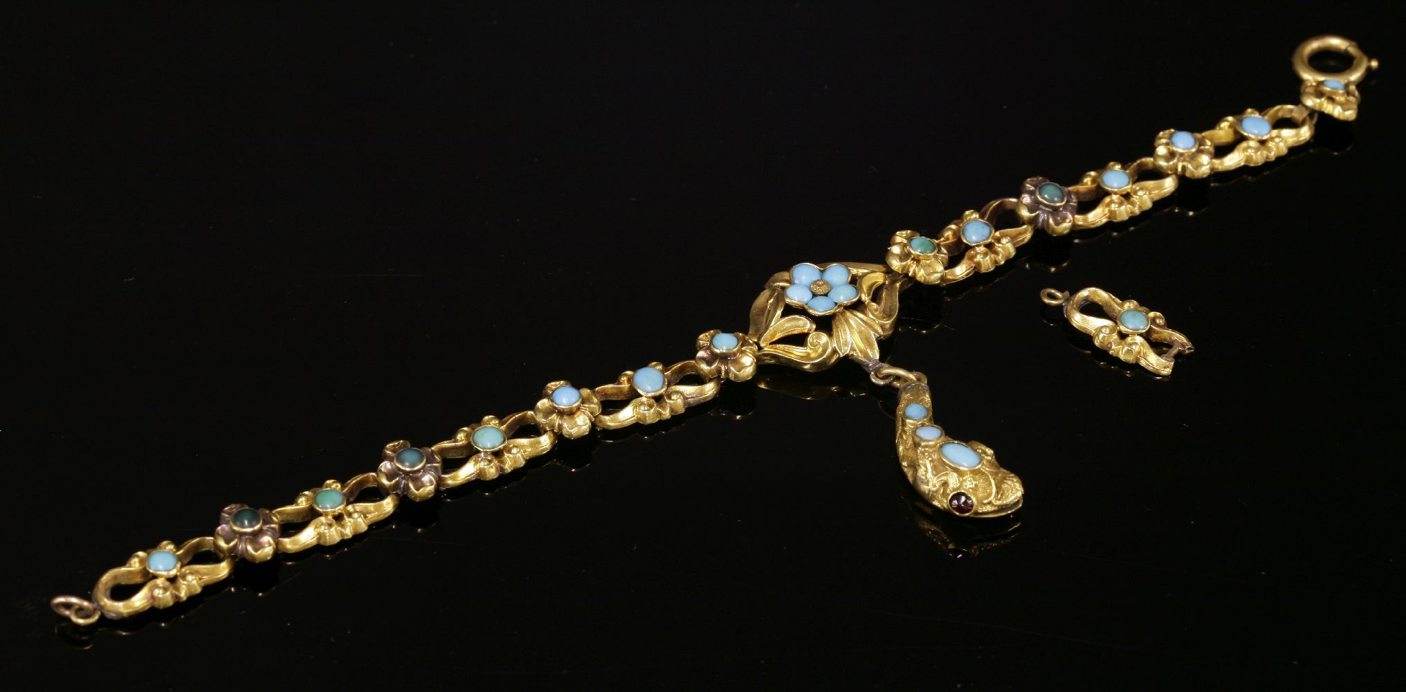 A Victorian gold, turquoise set bracelet,with a central snake head pendant drop. A lozenge-shaped